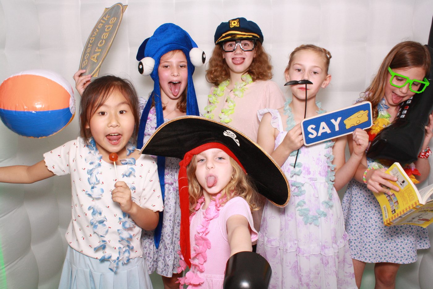 Group of kids with beach props in the FaceBooth photo booth