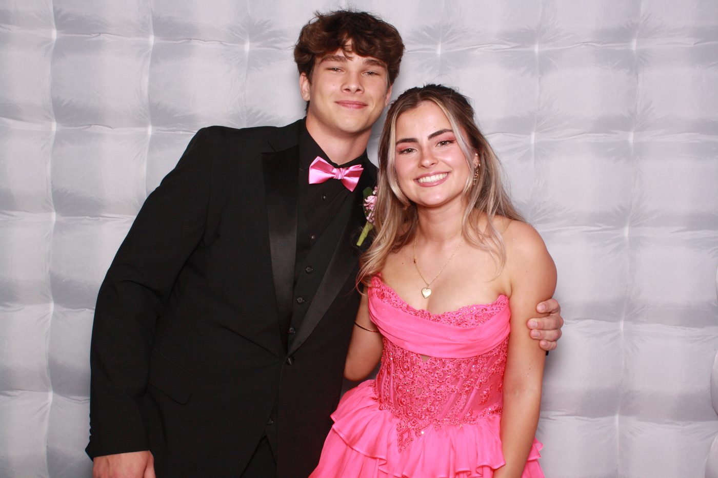 Prom couple posing in the FaceBooth photo booth